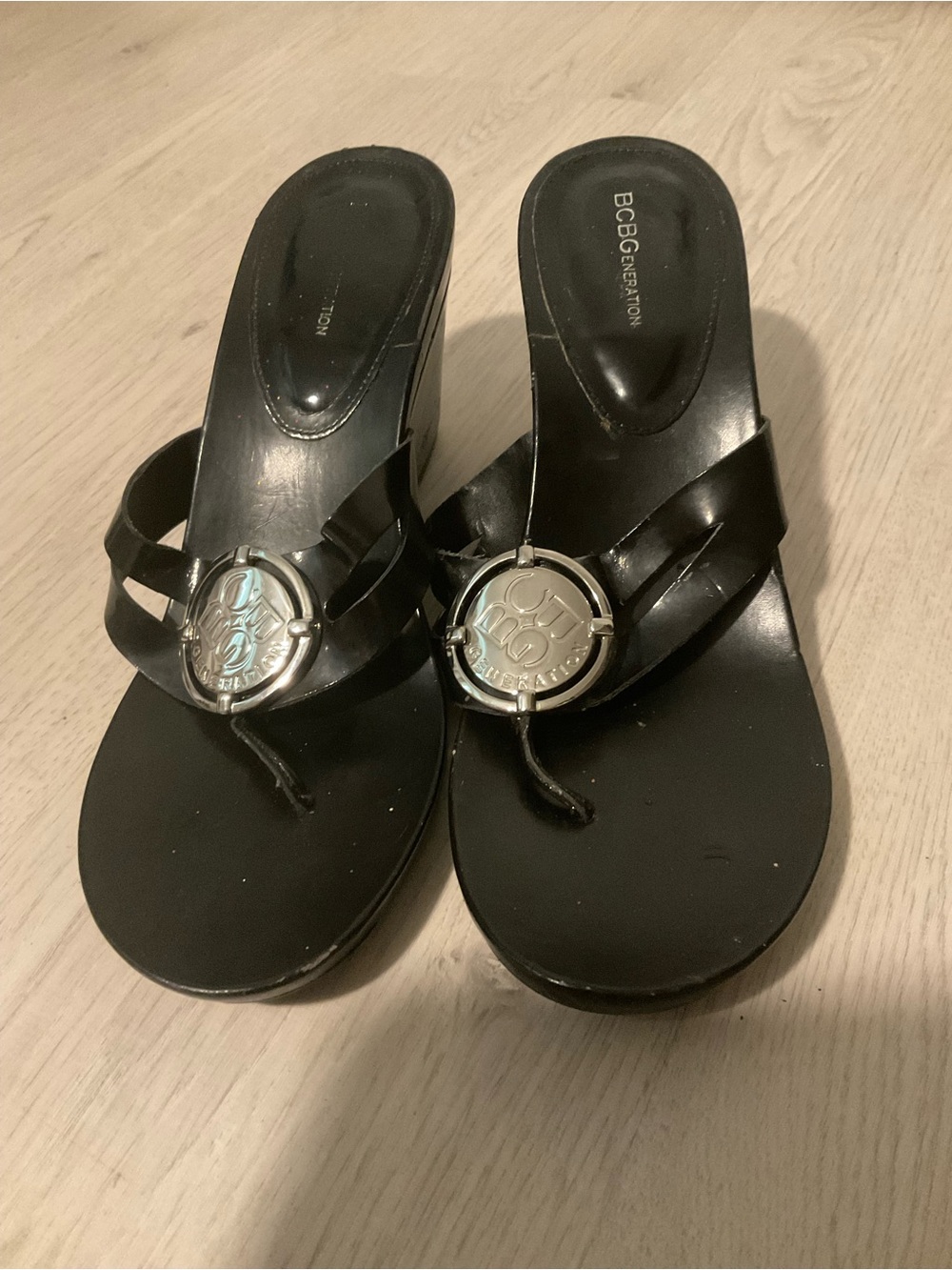 BCBGeneration Black Thong Sandals with Silver Logo Accent Size 9